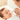 A mother do nose section to a sleeping baby
