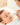 A mother do nose section to a sleeping baby