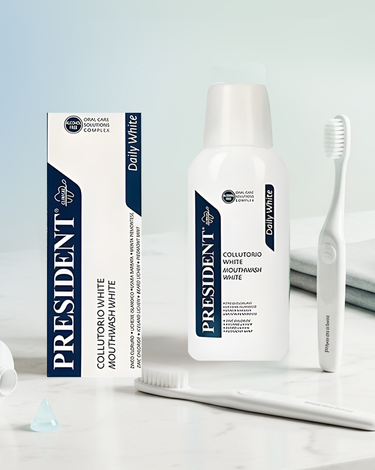 President brand mouthwash, box, and two white 